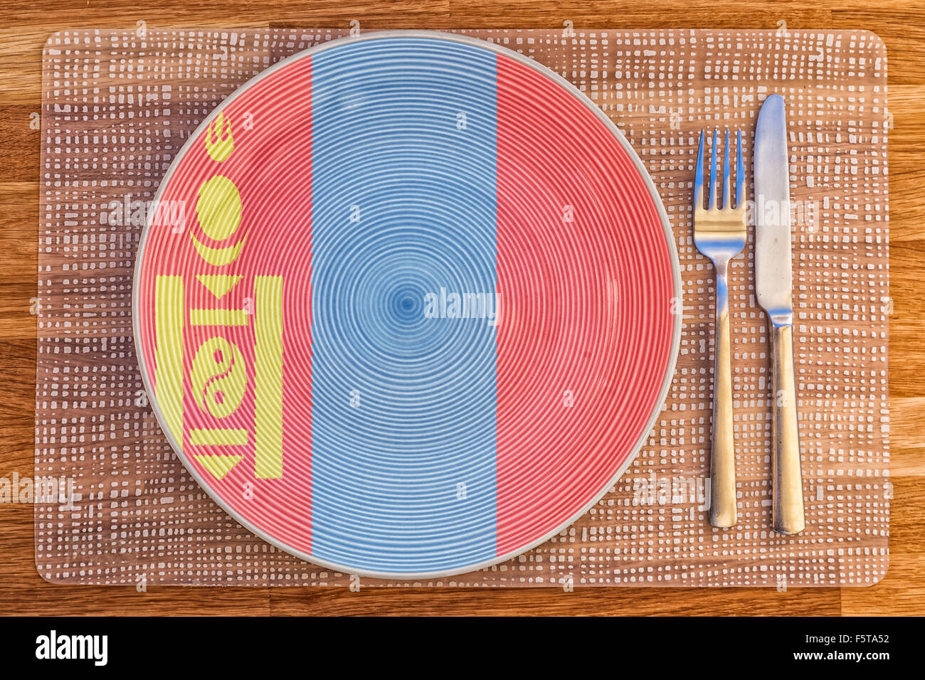 Assiette à dîner avec le drapeau de la Mongolie sur elle pour votre nourriture et boisson des concepts. Banque D'Images