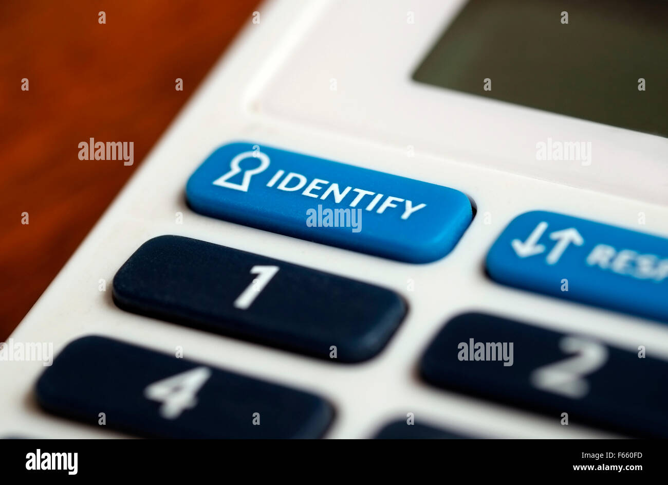 Identifier sur le bouton Lecteur de carte de débit Banque D'Images