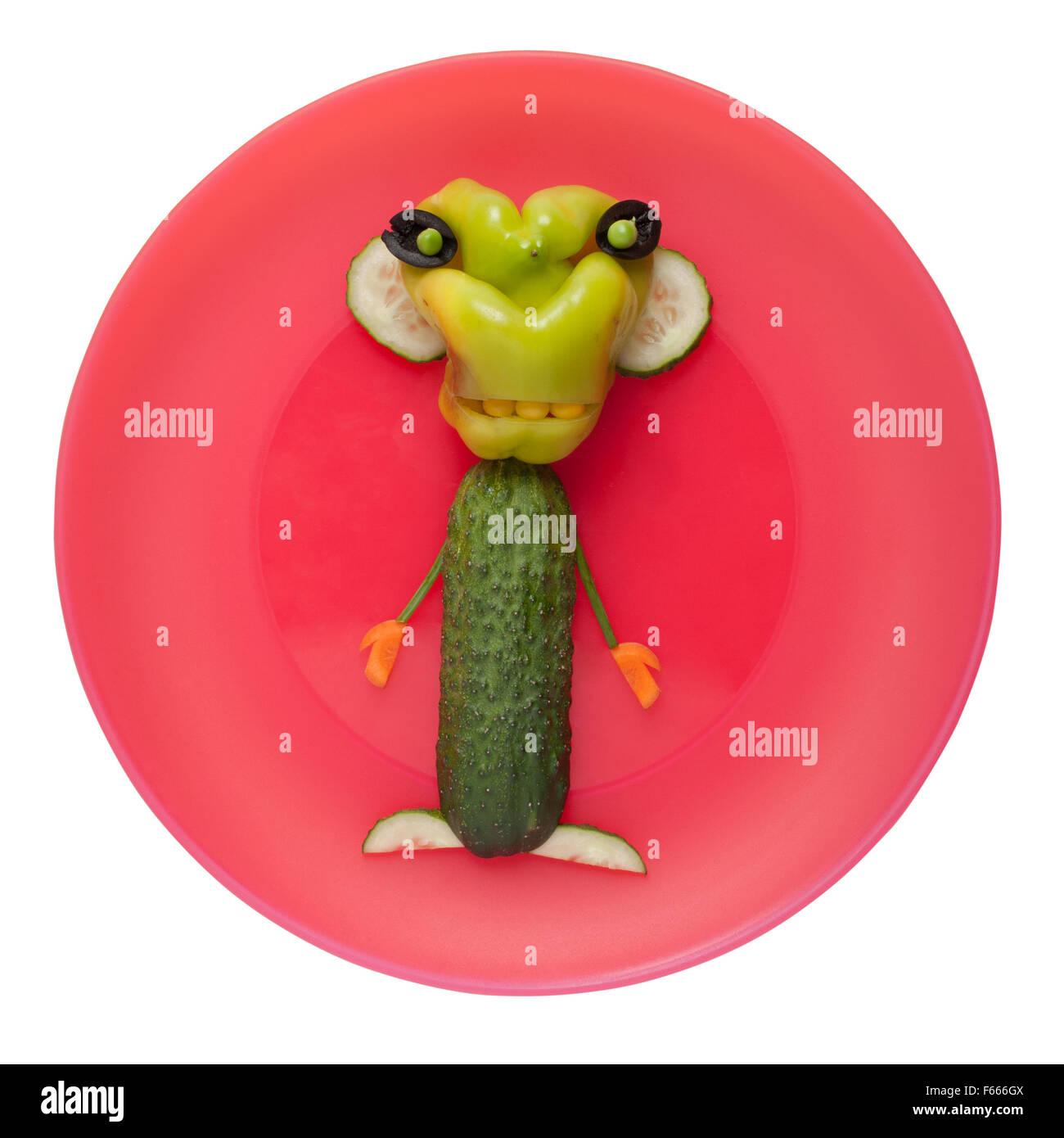 Funny monster légumes sur plaque rose Banque D'Images
