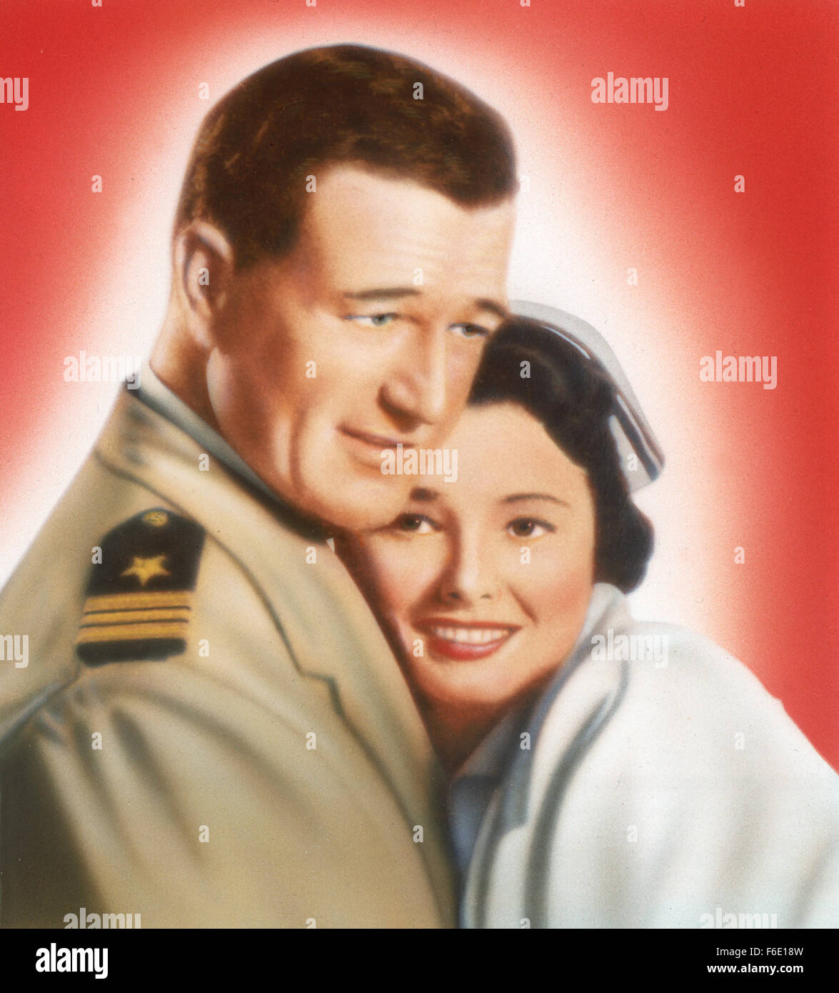 DATE DE SORTIE : Janvier 27, 1951. Titre du film : l'opération du Pacifique. STUDIO : Warner Bros Pictures. Résumé : PENDANT LA SECONDE GUERRE MONDIALE, Duke E. Gifford est commandant en second de l'USS Thunderfish, un sous-marin qui est le tir de torpilles qu'exploser trop tôt ou ne jamais exploser à tous. C'est un dilemme qu'il va éventuellement prendre personnellement. Encore plus personnelle est sa quête pour reconquérir son ex-femme, une infirmière ; mais il devra gagner son retour d'un aviateur de la marine qui se trouve être son petit frère du commandant. Photo : JOHN WAYNE le lieutenant Cmdr. Duke E. Gifford et PATRICIA NEAL Le Lieutenant Marie Stuart. Banque D'Images