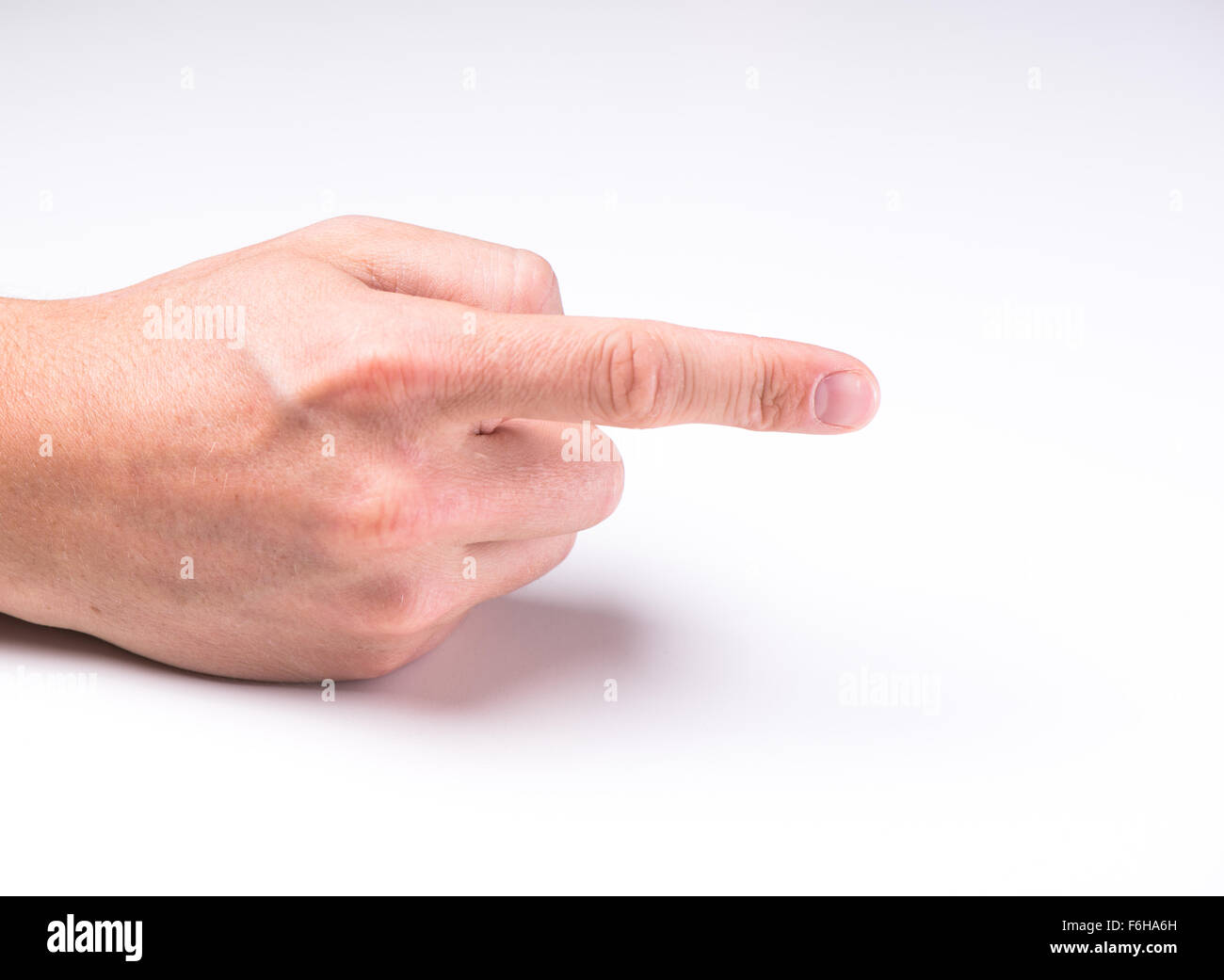 Une main avec un doigt poiting sur fond blanc Banque D'Images