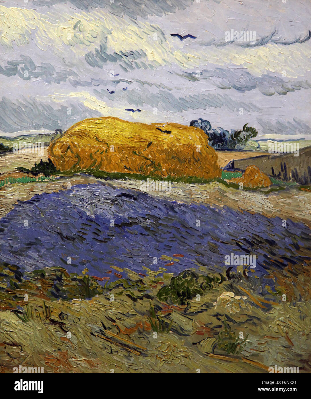 Pile de blé sous ciel nuageux (1889) de Vincent van Gogh (1853-1890) Banque D'Images