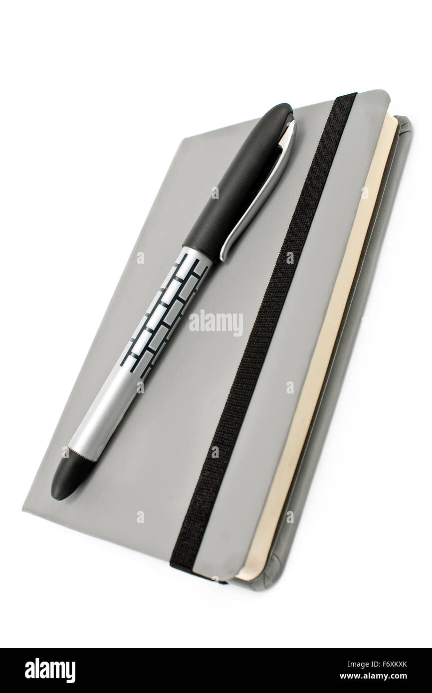 Le bloc-notes et stylo isolated on white Banque D'Images