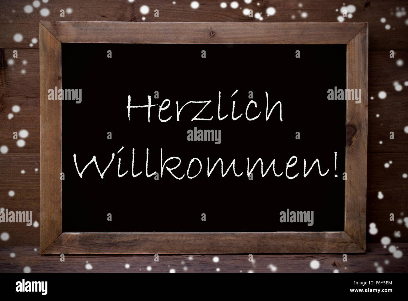 Tableau sur Herzlich Willkommen signifie bienvenue, Snowflakes Banque D'Images