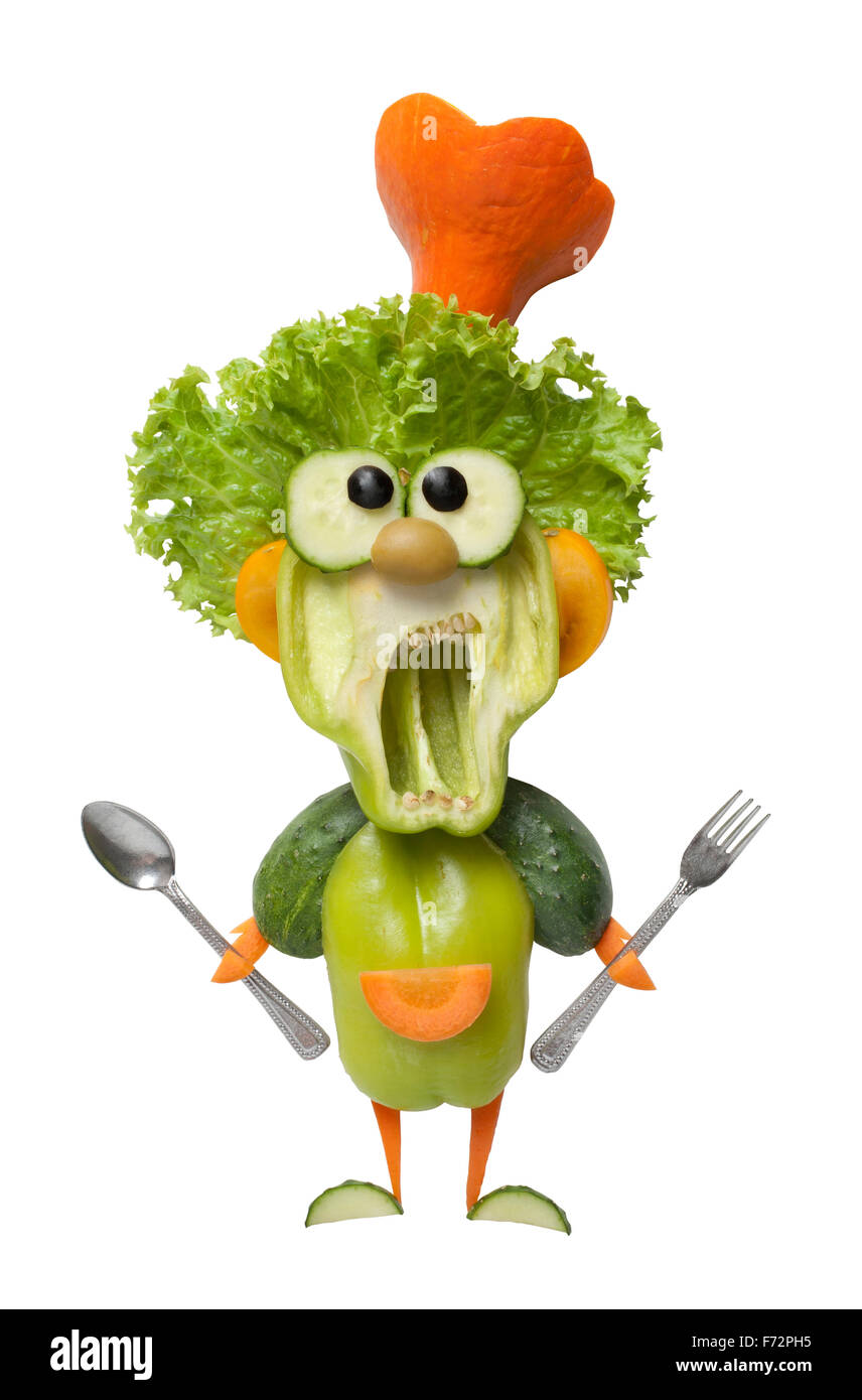Funny cook légumes avec fourchette et cuillère Banque D'Images