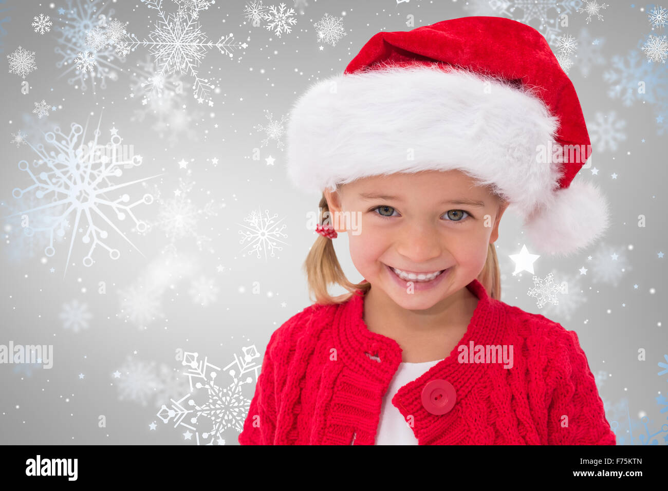 Image composite de cute little girl wearing santa hat Banque D'Images