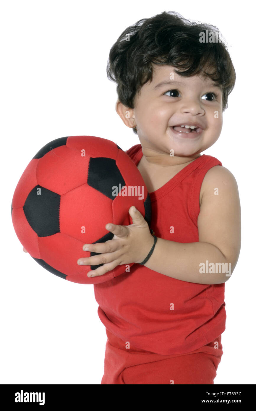 Baby Boy holding ball Banque D'Images