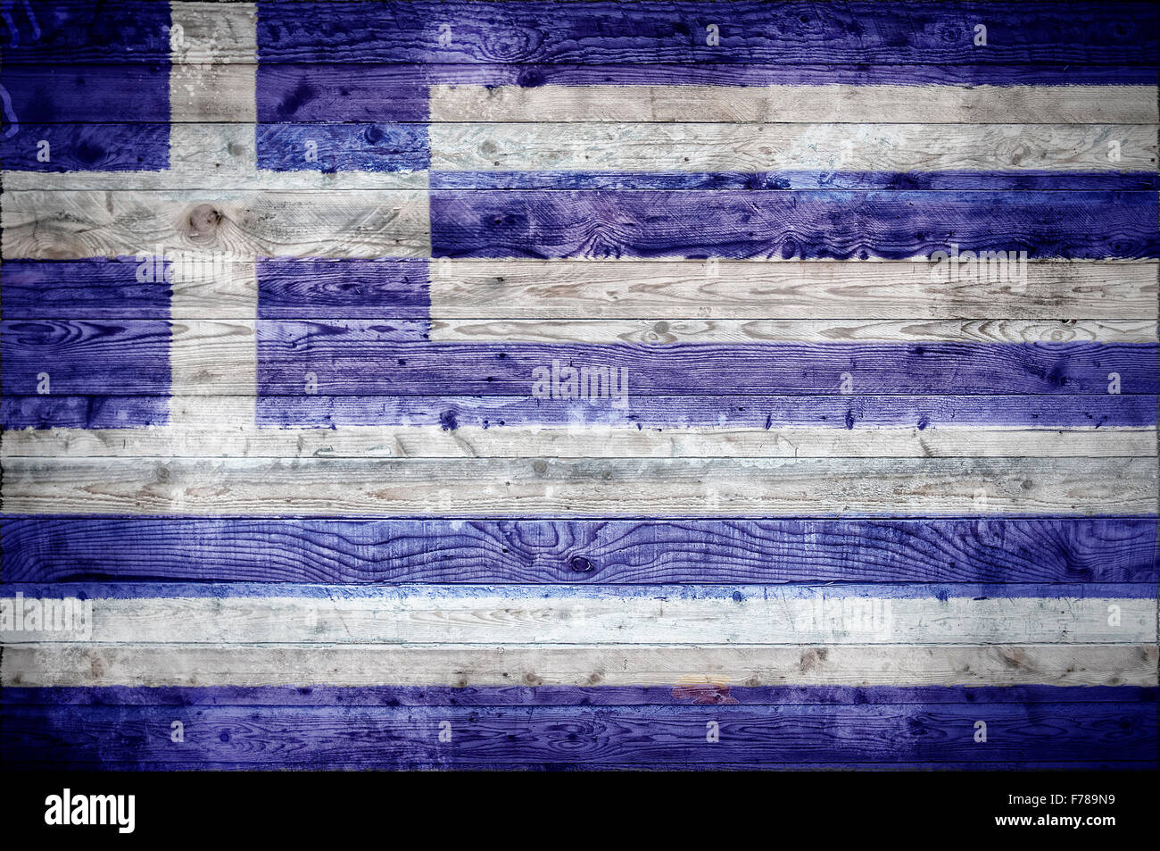 Une vignetted image de fond du drapeau de la Grèce peints sur des planches de bois d'un mur ou le plancher. Banque D'Images