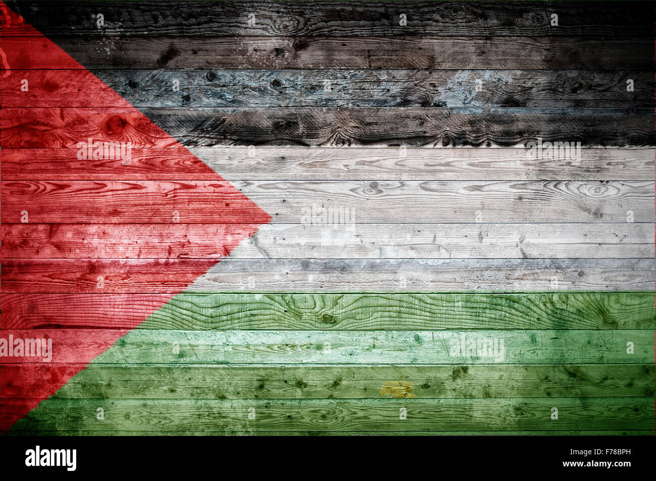 Une vignetted image d'arrière-plan le drapeau de la Palestine sur les planches de bois d'un mur ou le plancher. Banque D'Images