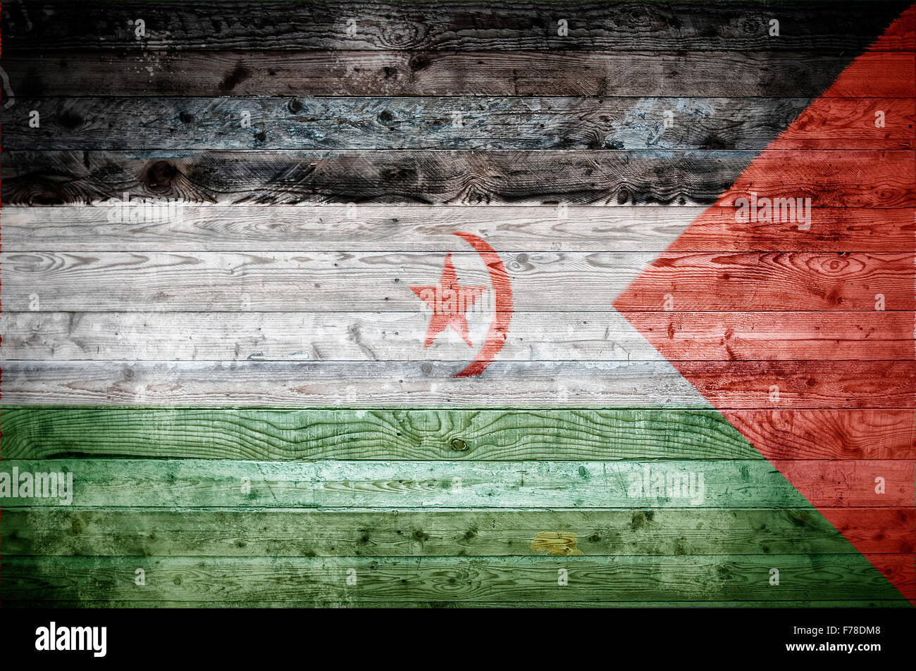Une vignetted image de fond du drapeau du Sahara occidental sur les planches de bois d'un mur ou le plancher. Banque D'Images