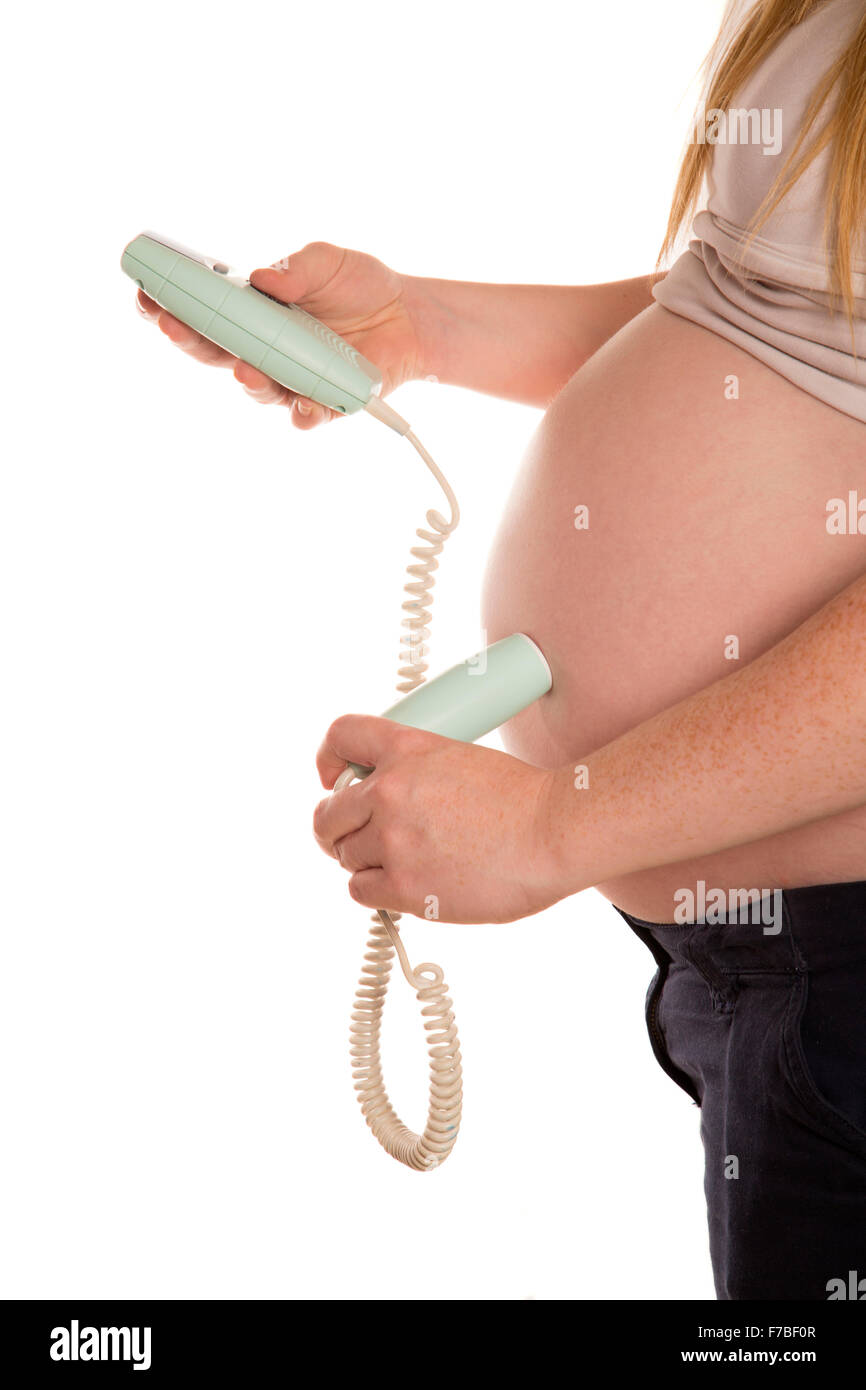 Les femmes enceintes à l'aide d'une découpe doppler accueil Banque D'Images