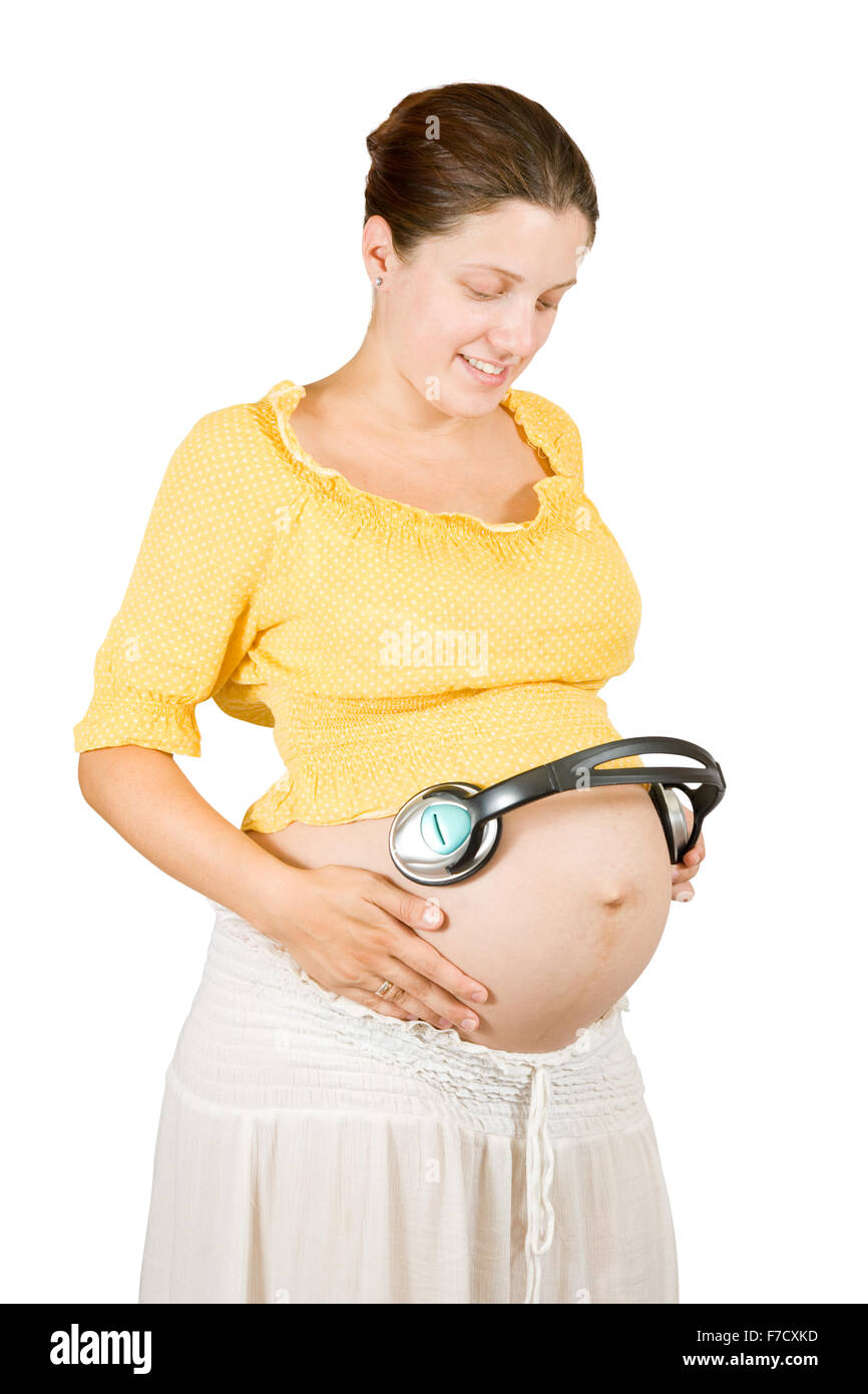 Femme Enceinte Avec Un Casque Sur Le Ventre Avec La Musique Relaxante Jouant Pour Bebe Dans L Uterus Photo Stock Alamy