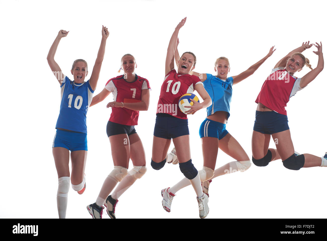 Jeu de volley-ball sport avec groupe de jeunes belles filles dans le sport indoor arena net ball Banque D'Images