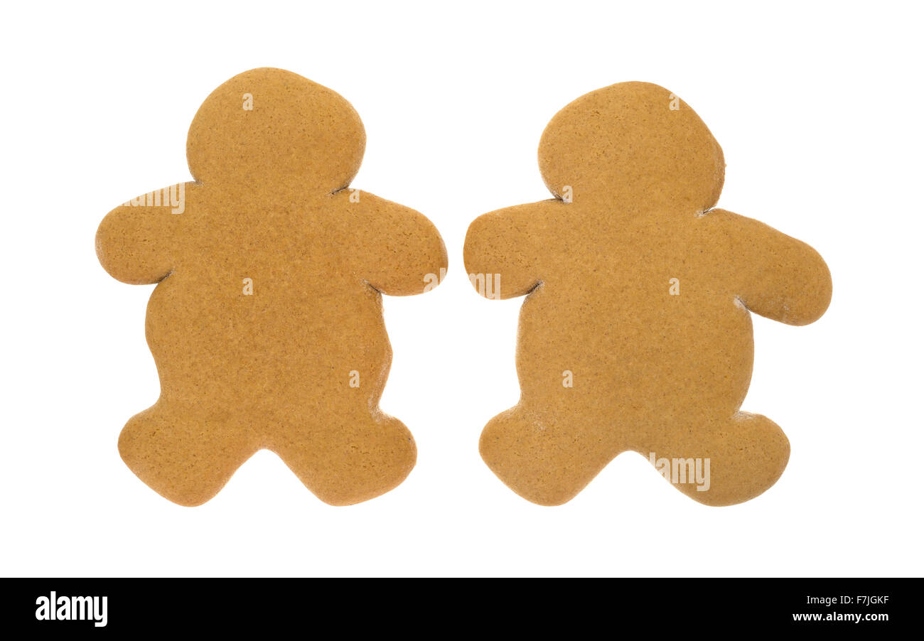 Deux hommes unfrosted gingerbread cookies de Noël côte à côte sur un fond blanc. Banque D'Images