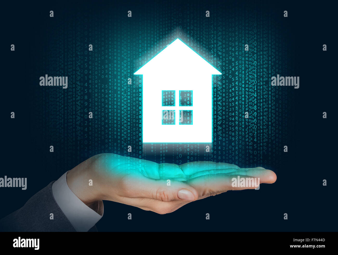 Maison blanche flotte sur la main de l'homme Banque D'Images