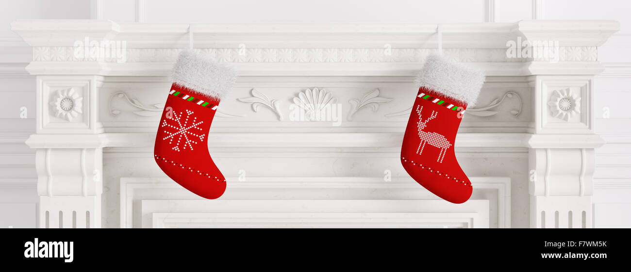 Deux bas de Noël rouge accroché sur marbre sculpté cheminée en pierre le rendu 3D Banque D'Images