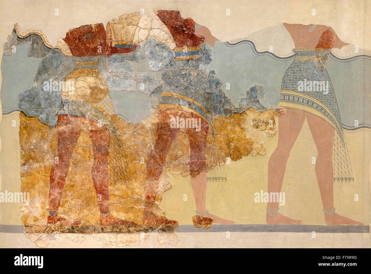 Fragment de la fresque de procession le Palais Minoen de Knossos. Trois personnages masculins sont indiquées avec des cadeaux. Banque D'Images