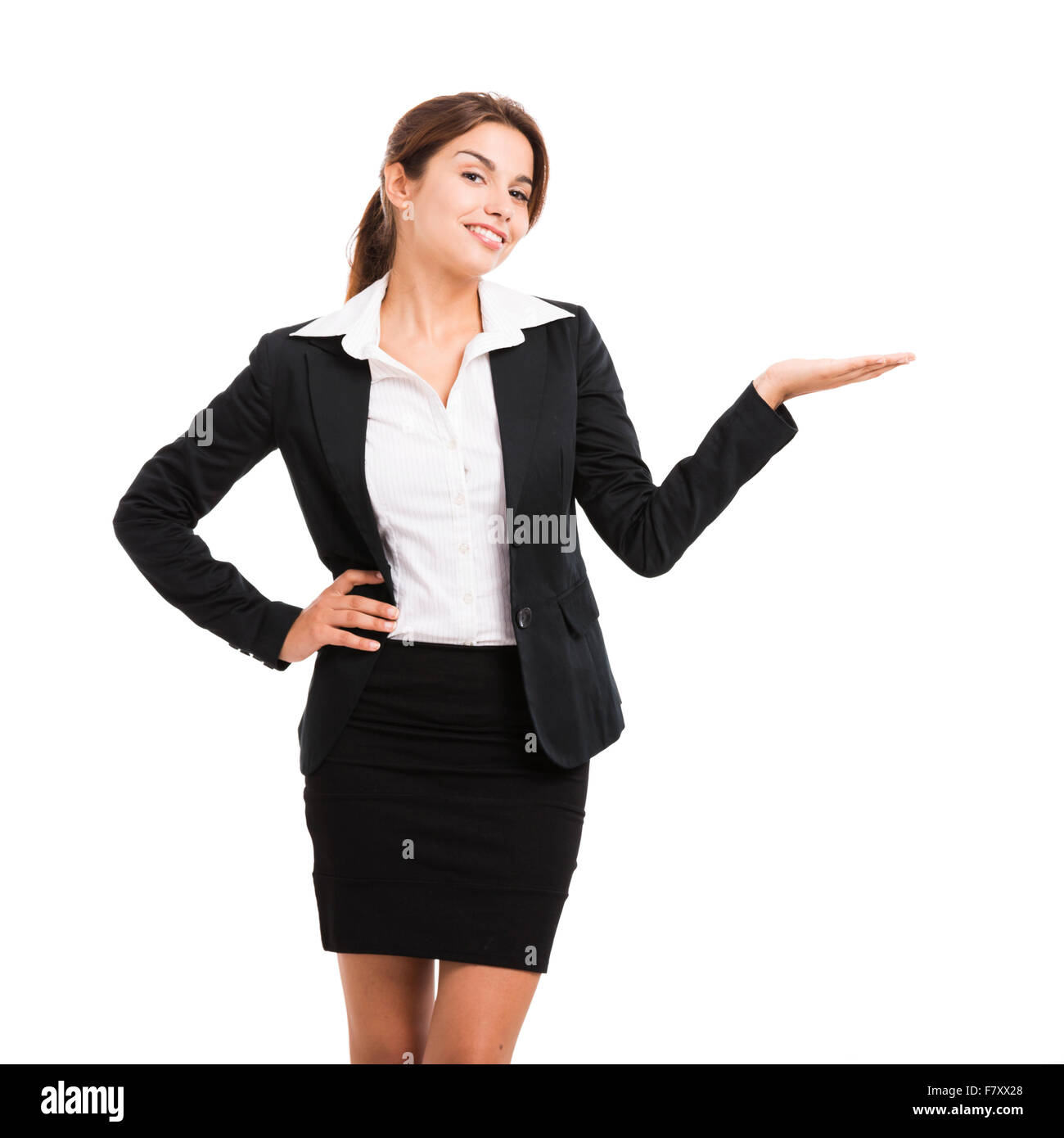 Beautiful hispanic business woman smiling over a white background et montrant quelque chose Banque D'Images