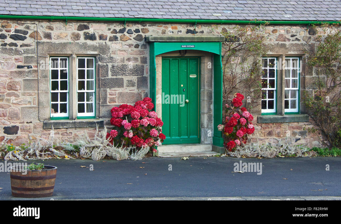 La porte verte du chalet dans le Northumberland Banque D'Images