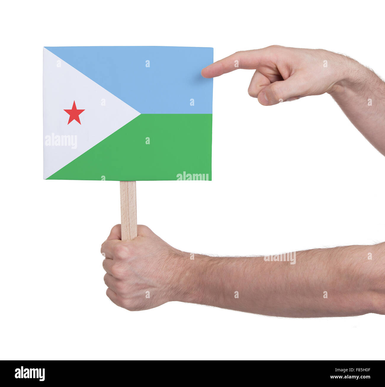 Main tenant petite carte, isolé sur blanc - Pavillon de Djibouti Banque D'Images