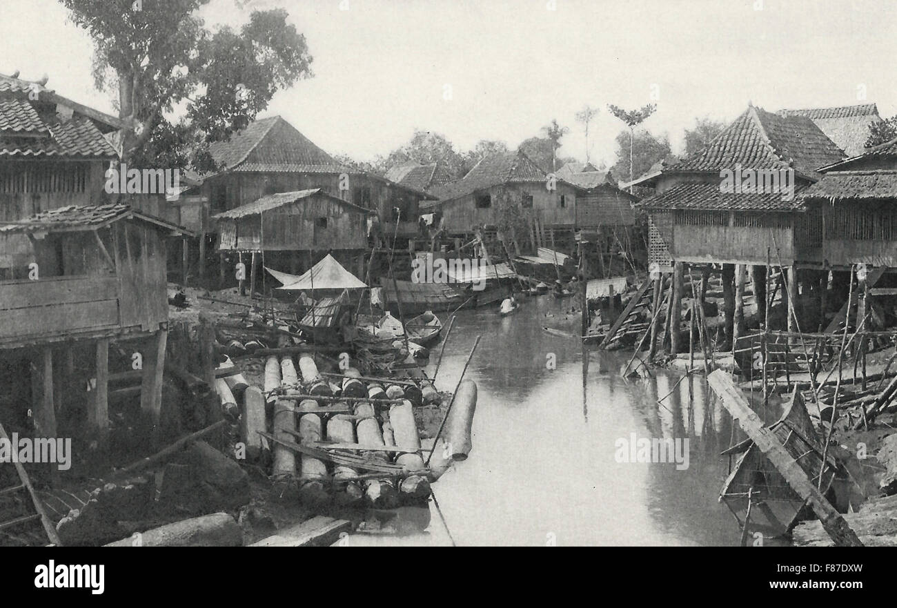 Un Village Malais - Les maisons d'un Village Malais sont toujours sur l'eau, si possible, et invariablement posée sur pilotis au-dessus du sol de six à huit pieds, vers 1900 Banque D'Images