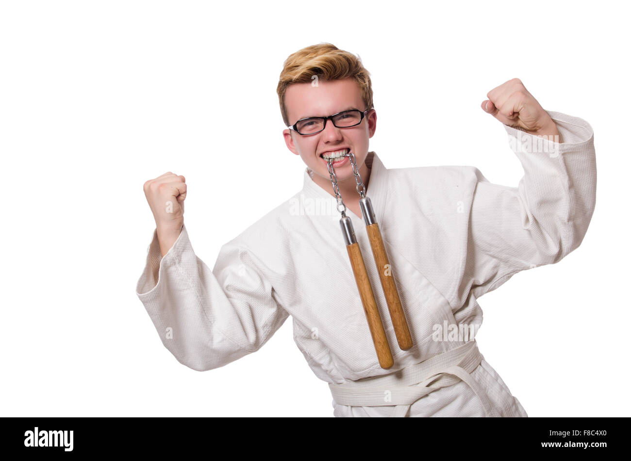 Funny karate fighter avec nunchucks on white Banque D'Images