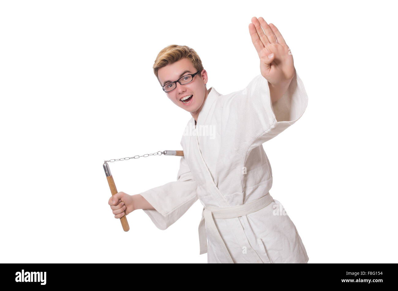 Funny karate fighter avec nunchucks on white Banque D'Images