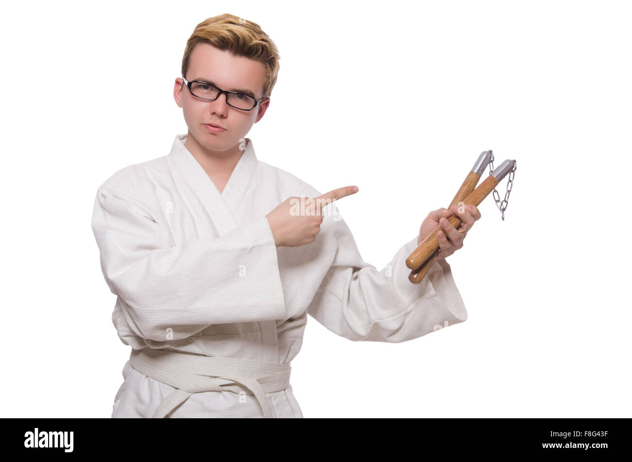 Funny karate fighter avec nunchucks on white Banque D'Images