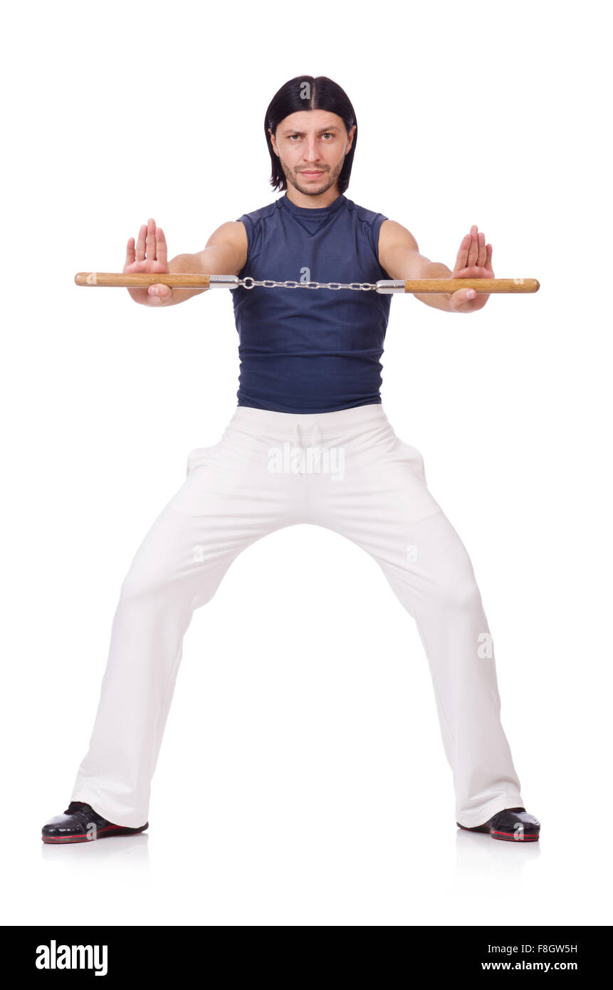 Funny karate fighter avec nunchucks on white Banque D'Images