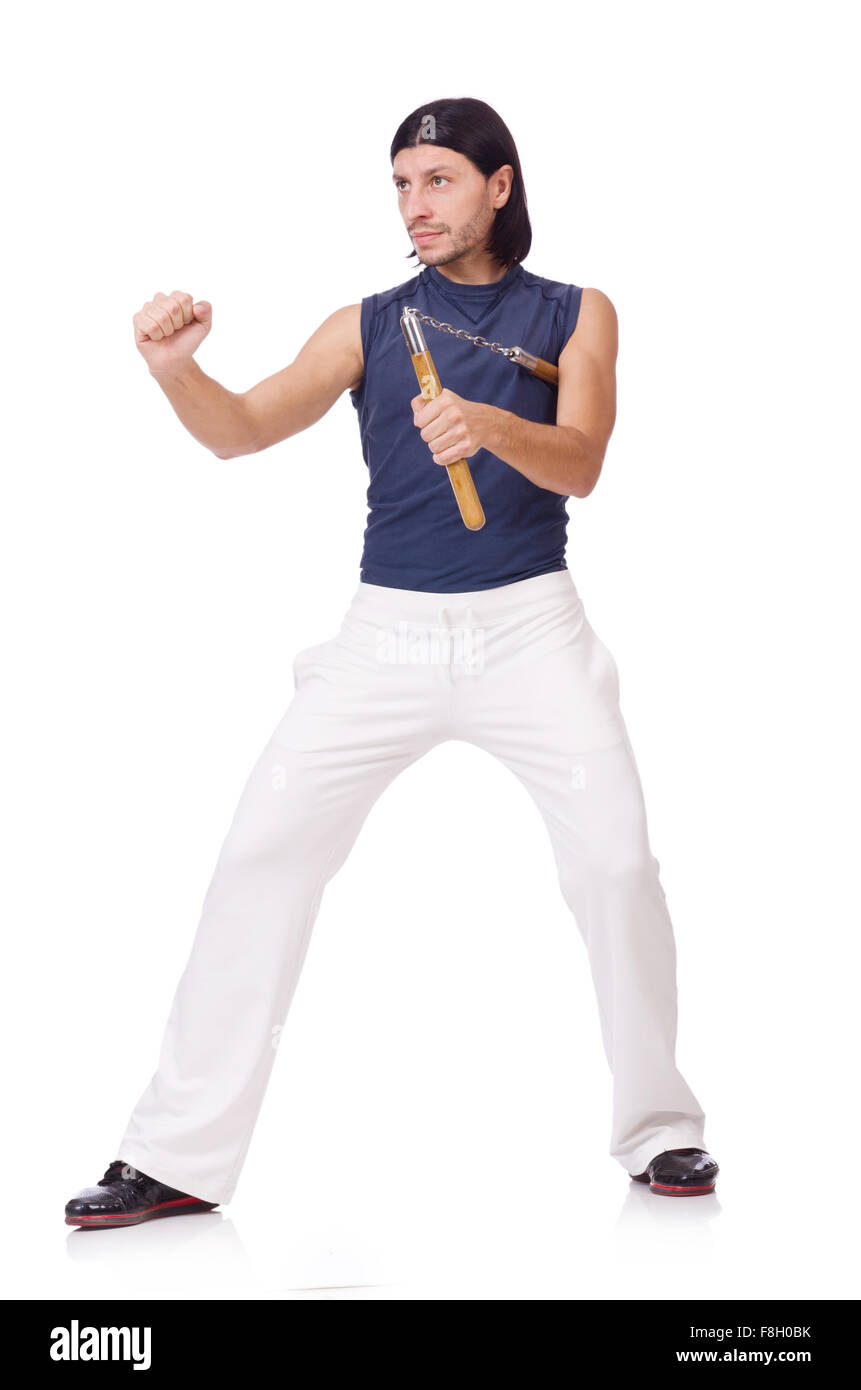 Funny karate fighter avec nunchucks on white Banque D'Images