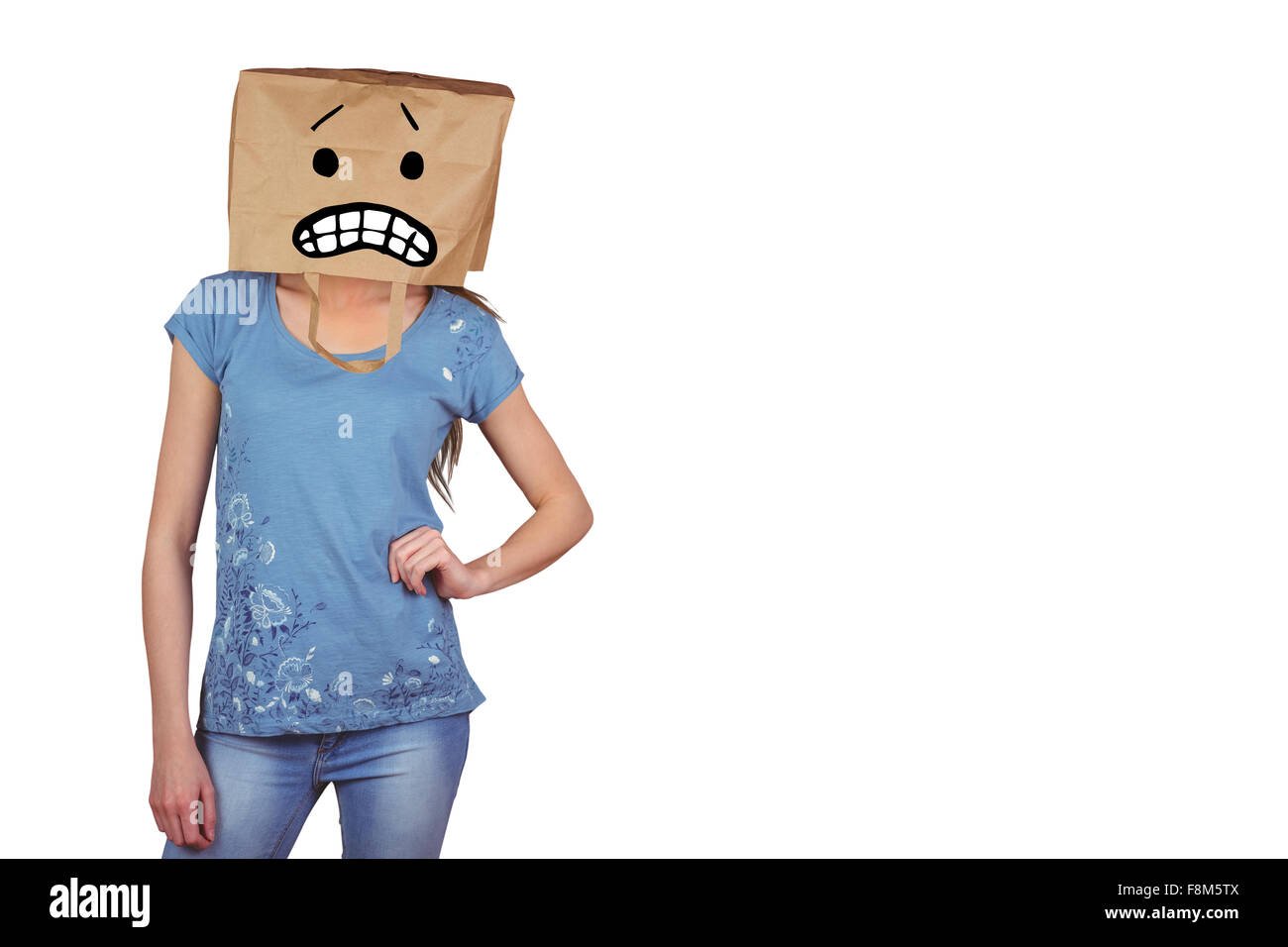 Image composite de Dame posant avec un sac sur la tête Banque D'Images