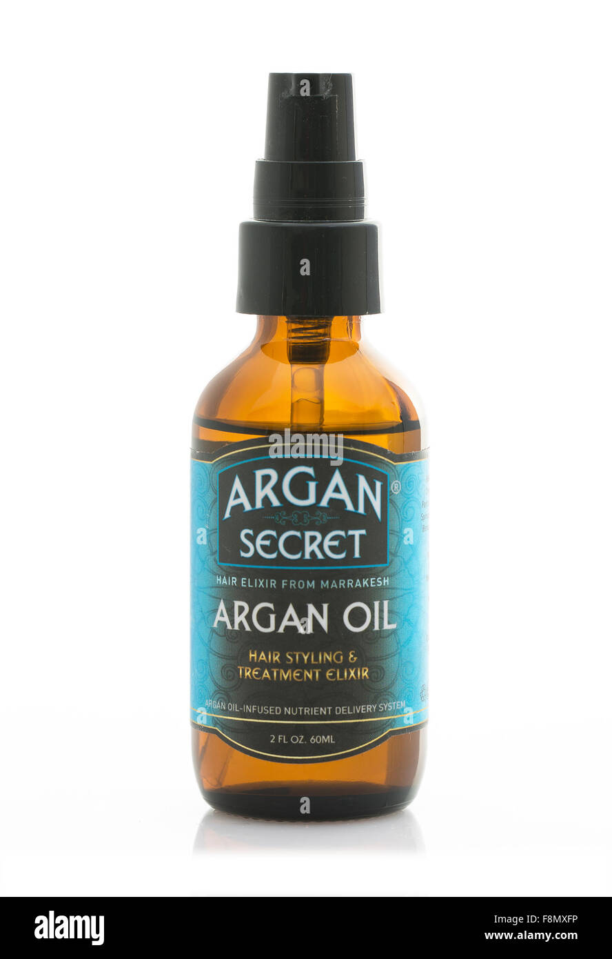 Secret d'Argan cheveux styling traitement Elixir d'huile sur un fond blanc. Banque D'Images