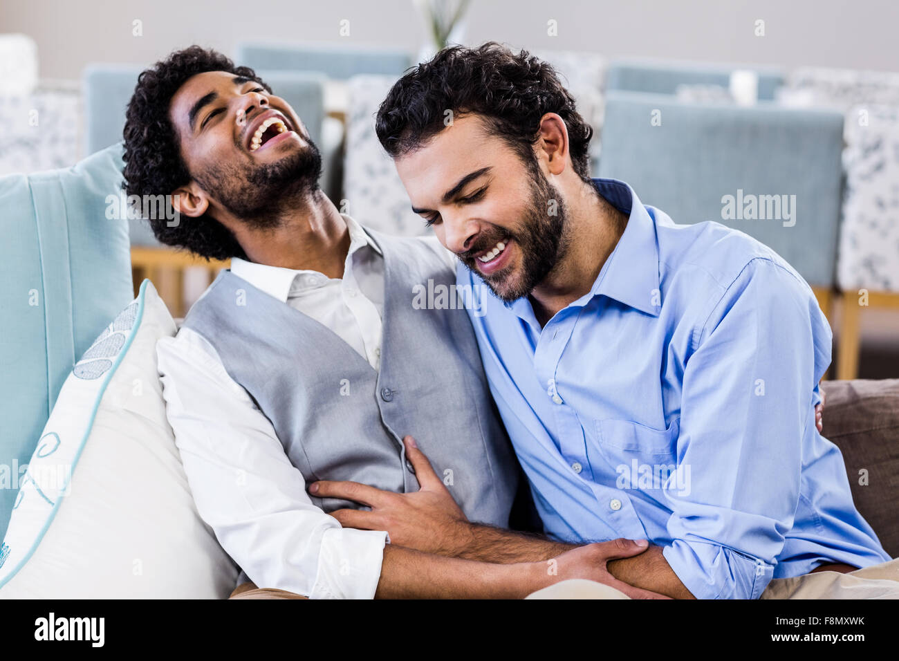 Happy gay couple laughing Banque D'Images