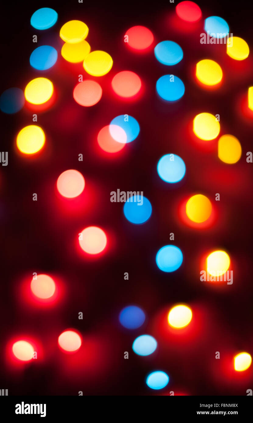 Les lumières de Noël de flou artistique. Bokeh Nouvel An. Résumé fond pour la conception de vacances Banque D'Images