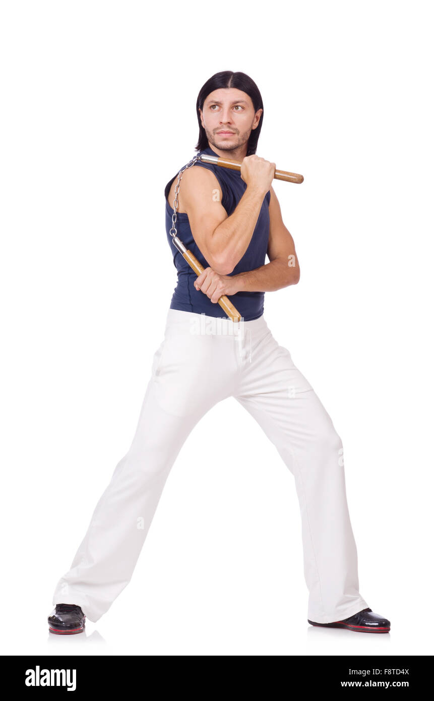 Funny karate fighter avec nunchucks on white Banque D'Images