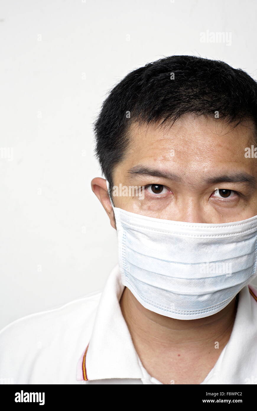 Asian man in portrait masque médical Banque D'Images