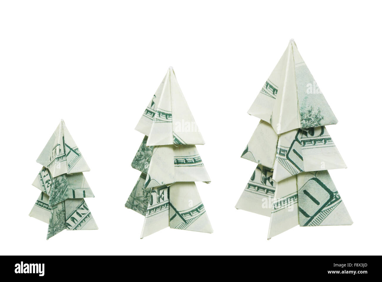 Les arbres de Noël faite de centaines de dollars sur un fond blanc Banque D'Images