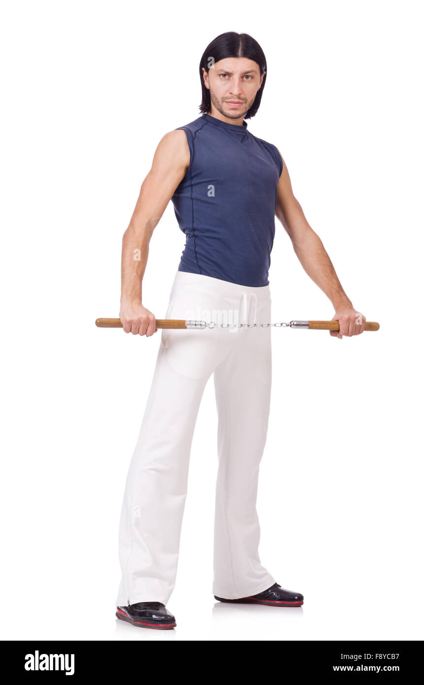 Funny karate fighter avec nunchucks on white Banque D'Images
