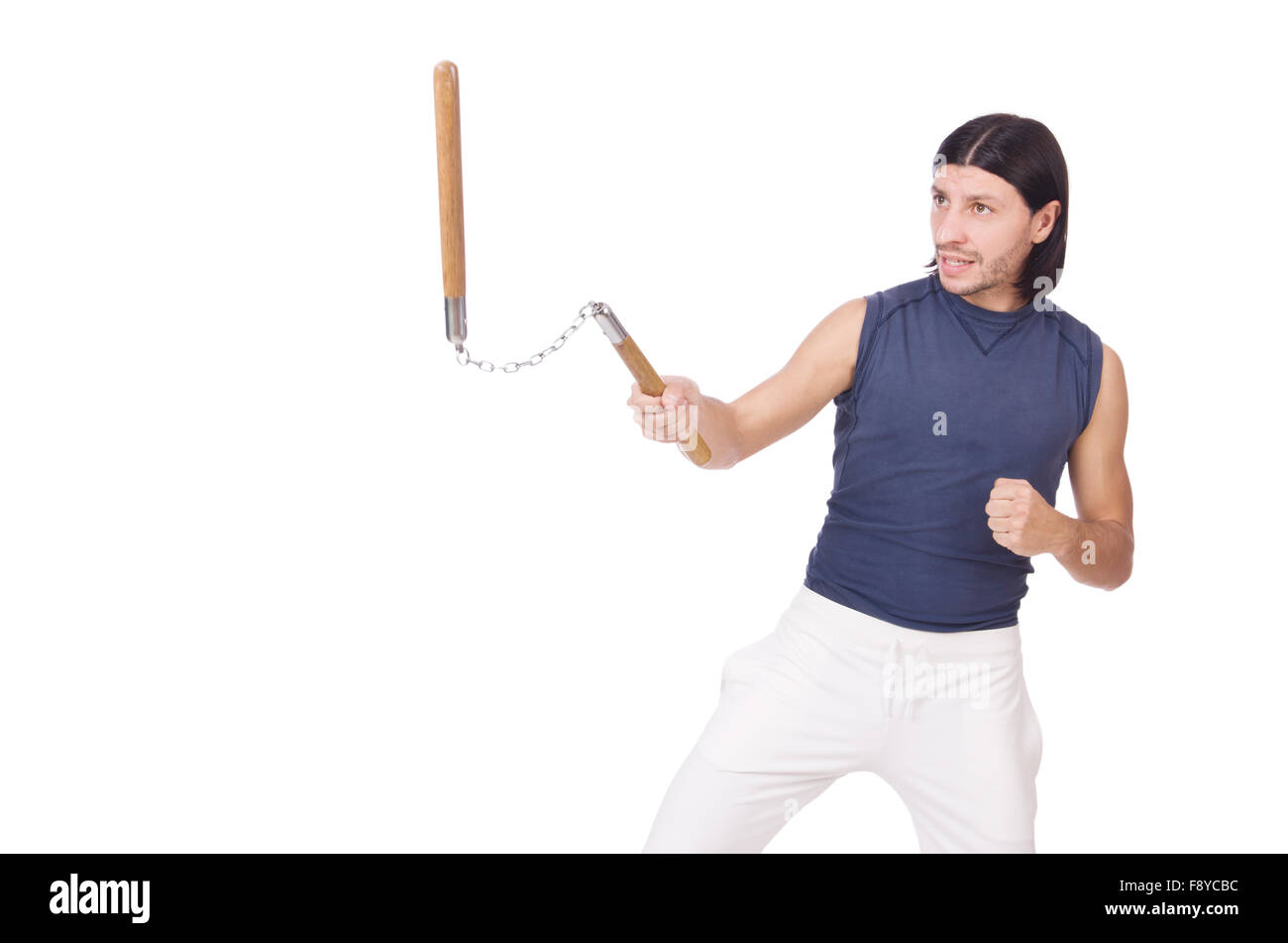 Funny karate fighter avec nunchucks on white Banque D'Images