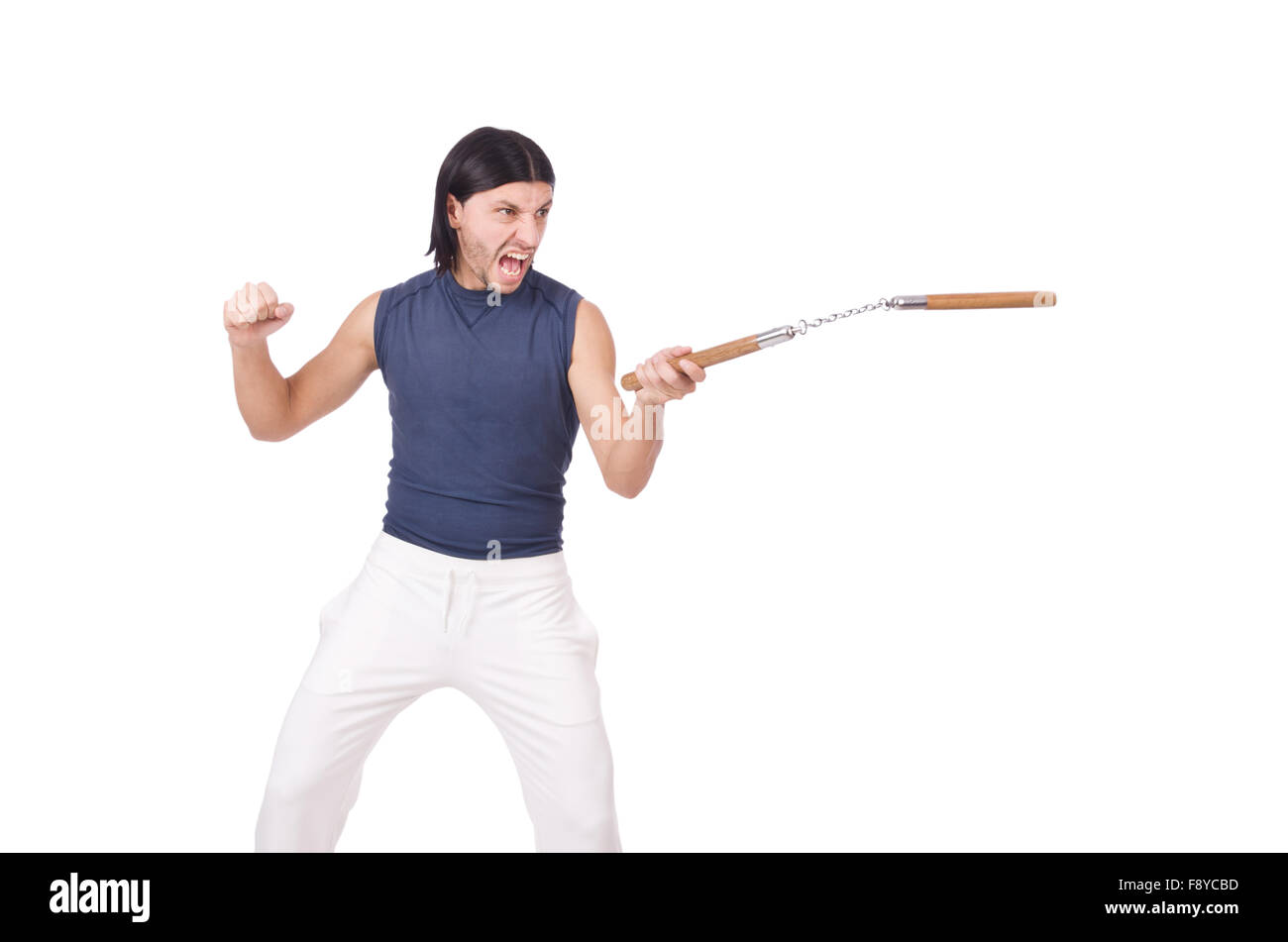 Funny karate fighter avec nunchucks on white Banque D'Images