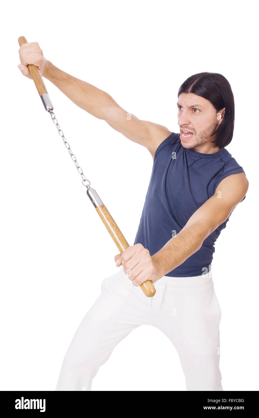 Funny karate fighter avec nunchucks on white Banque D'Images