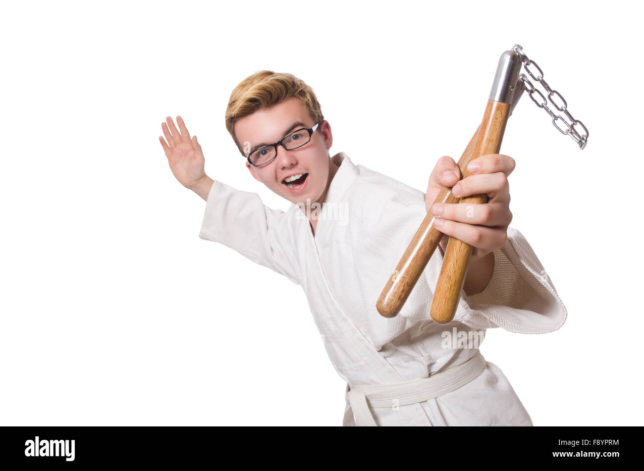 Funny karate fighter avec nunchucks on white Banque D'Images