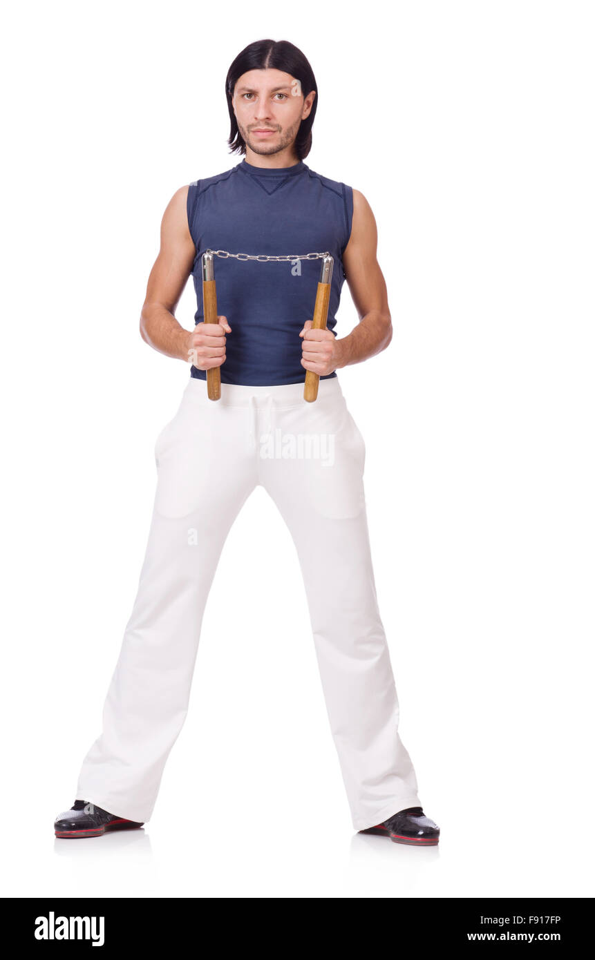 Funny karate fighter avec nunchucks on white Banque D'Images
