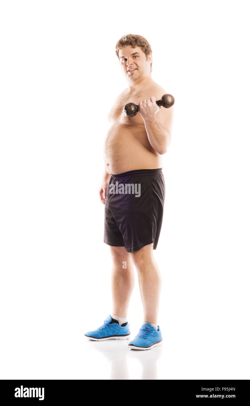 Fat Man fitness pose en studio sur fond blanc. Banque D'Images