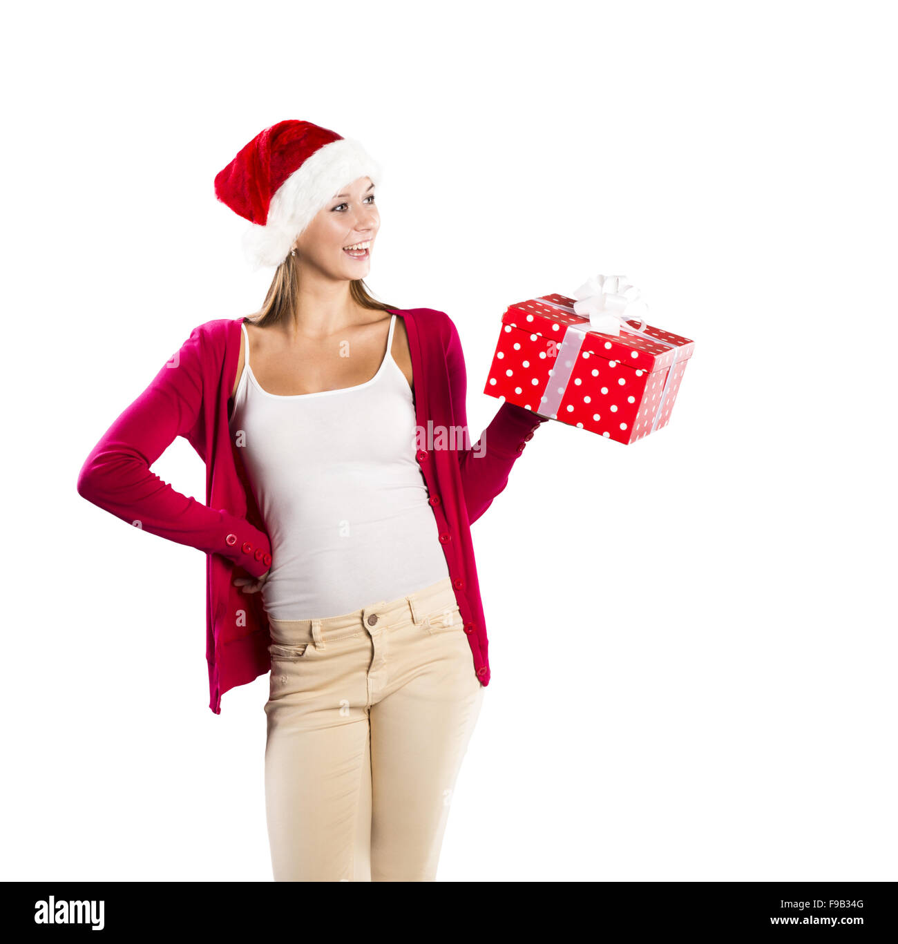 Beau noël woman is holding red gift in studio Banque D'Images