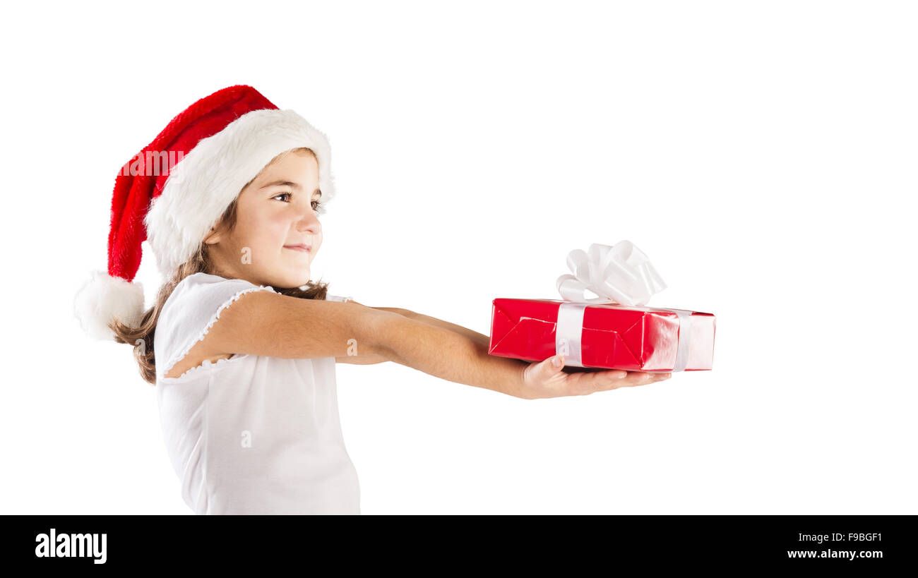 Petite fille heureuse à santa hat with christmas gift Banque D'Images