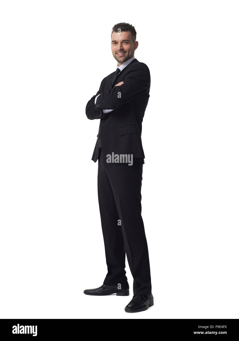 Businessman with folded hands full length portrait isolé sur fond blanc Banque D'Images