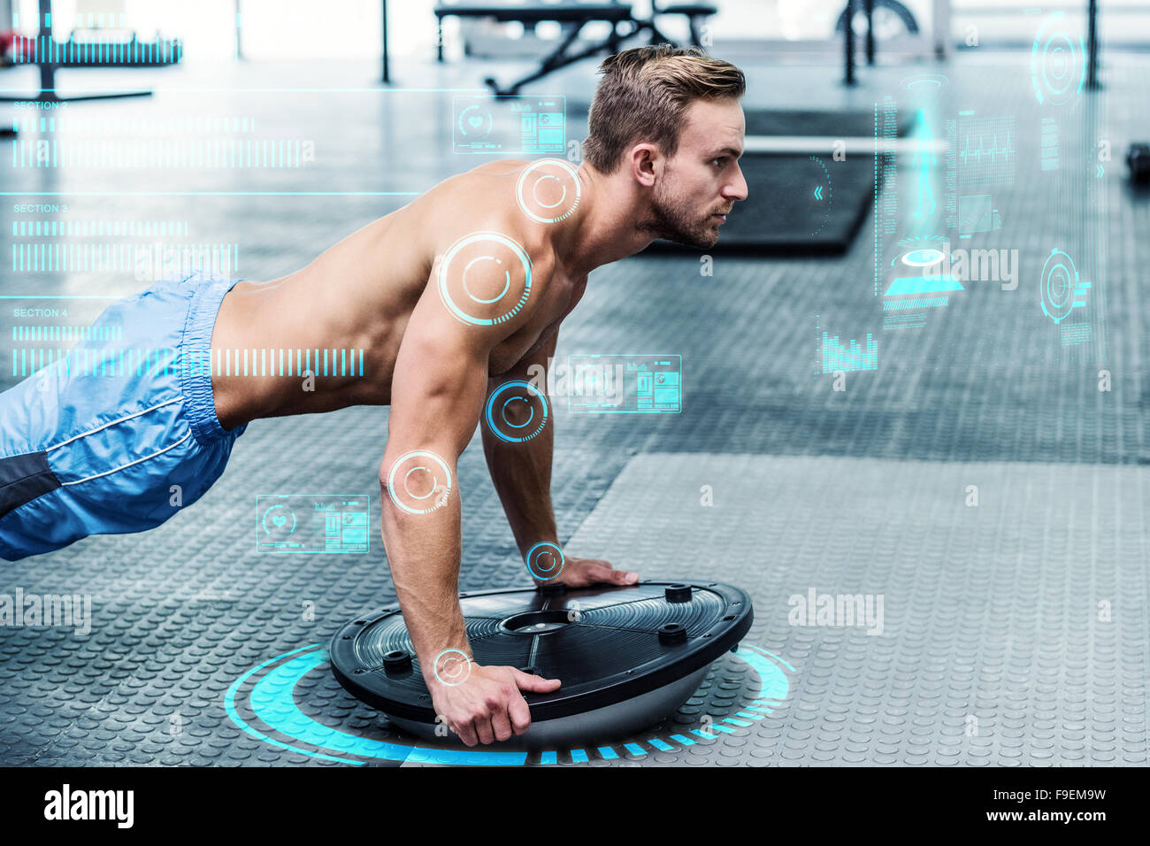 Image composite de l'homme musclé faisant bosu exercices ballon Banque D'Images