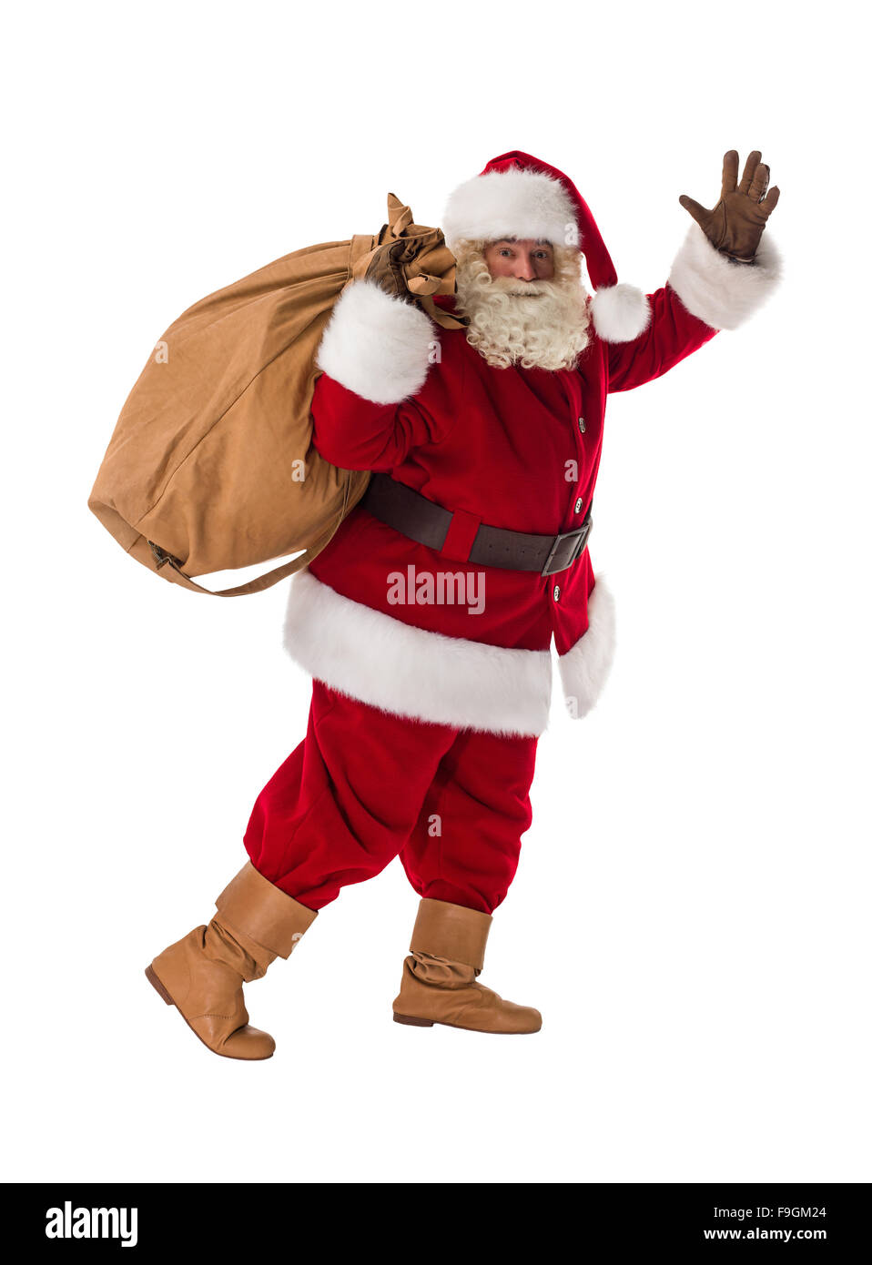 Le Père Noël la marche avec son gros sac un portrait Banque D'Images