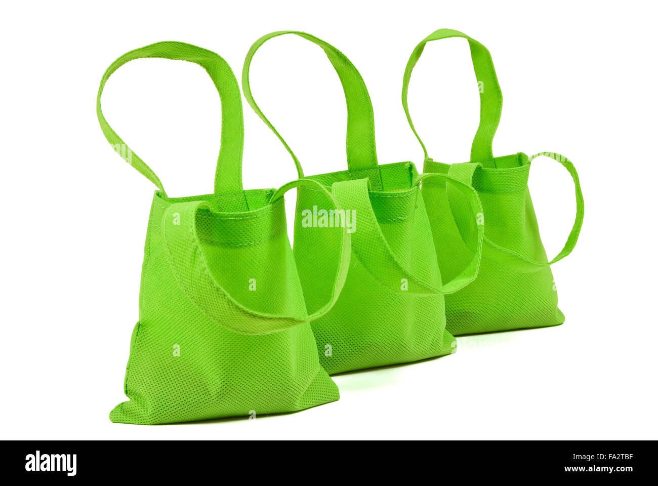 Trois sacs vert néon avec ombre Banque D'Images